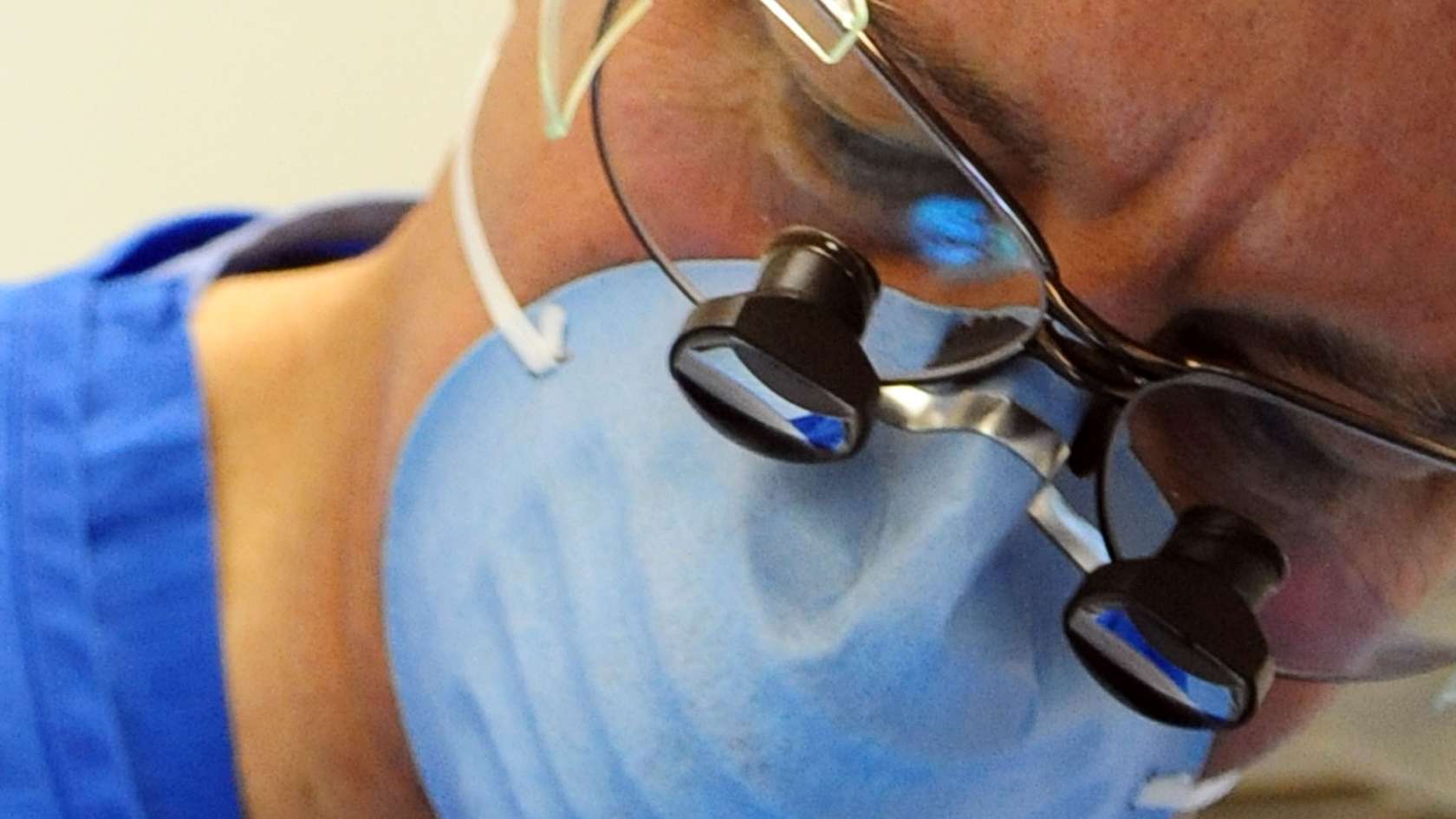 Pathologist inspecting mouth
